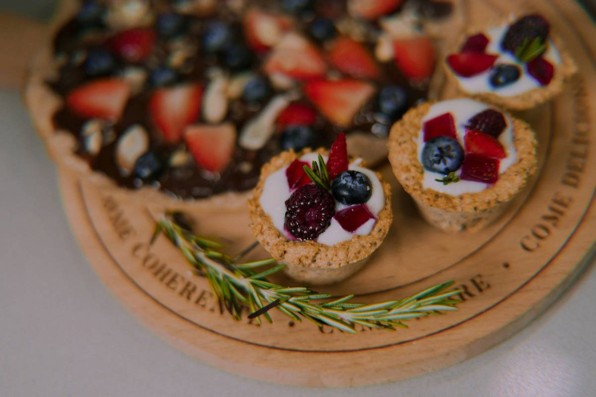 healthy desserts for adults: creamy organic chocolate chia pudding in glass jars with fresh berries